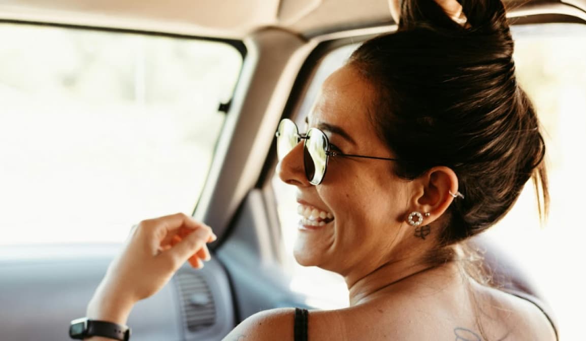 Woman smiling while driving